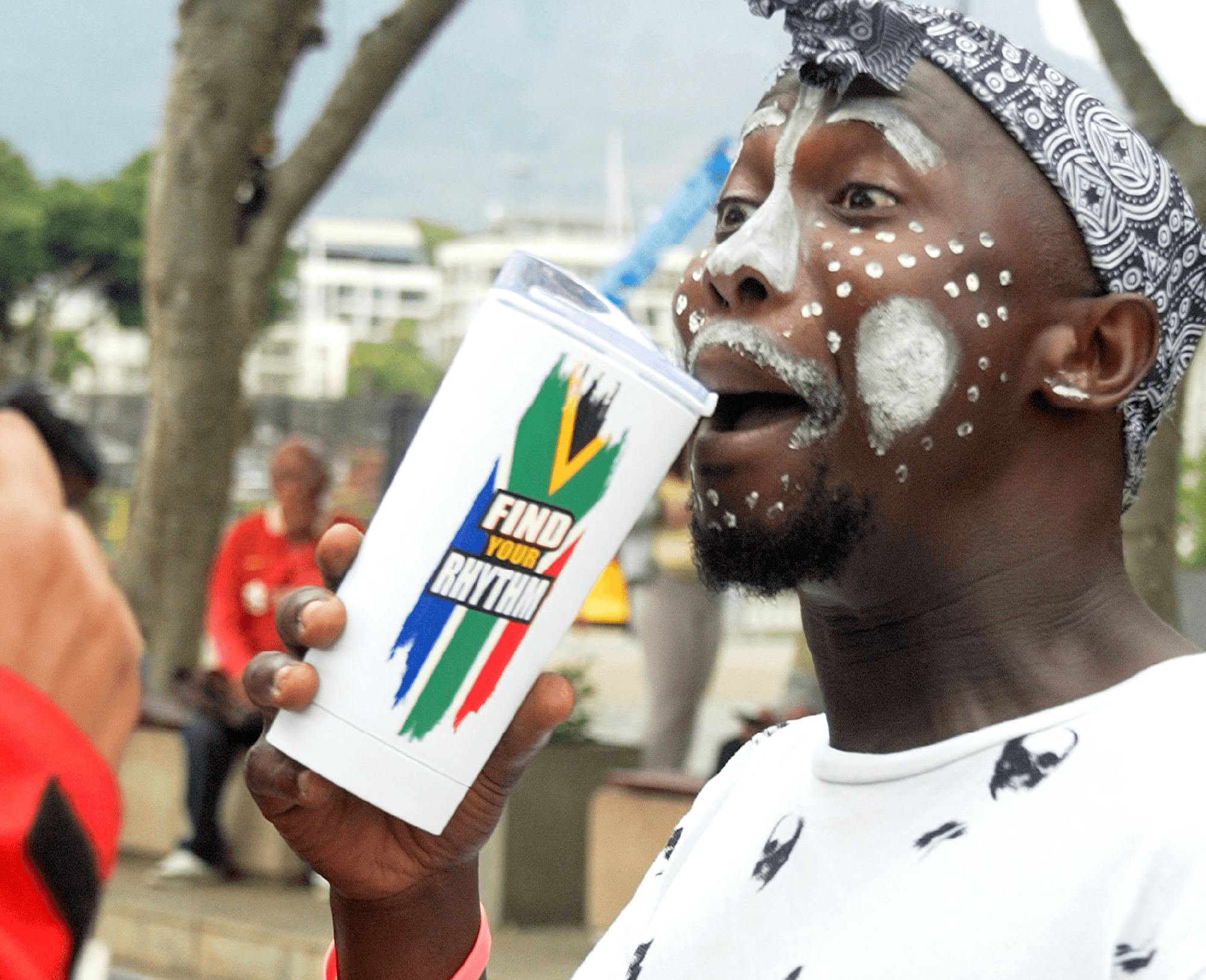 Person using a branded LoudCup at an outdoor event